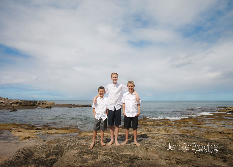 family pictures on the beach at disney aulani koolina by professional photographer