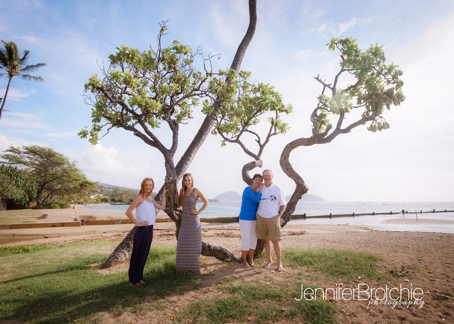 professional family photographer at disney aulani for beach photo shoots